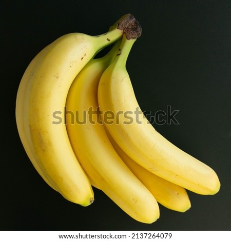 large organic yellow bananas top view high quality stock photo with black background wallpaper