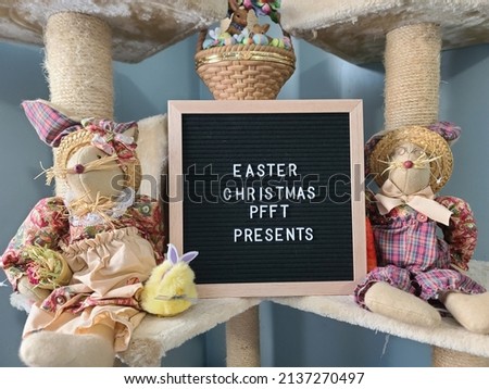 A closeup of a sign saying Easter Christmas Pffft Presents with Easter decorations around it.