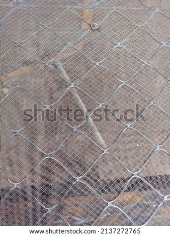 Stainless steel window net background texture. Steel net texture. Industrial steel net. Industrial concept. Industrial metal net design. Steel wire netting.
