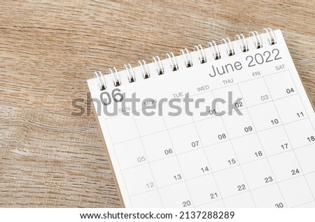 The June 2022 desk calendar on wooden background. Royalty-Free Stock Photo #2137288289