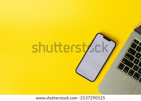 Smartphone in yellow background for business Royalty-Free Stock Photo #2137290125
