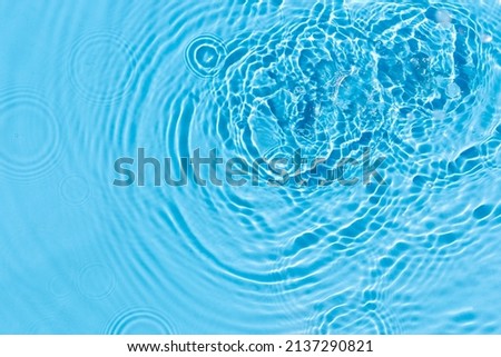 Abstract background of blue water under sunlight. Top view, flat lay.
