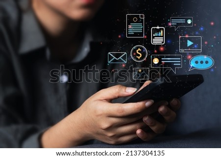 the businesswoman is working on a smartphone to use search engine optimization tools. To find customers or promote and advertise online content for technology, marketing, and business ideas.