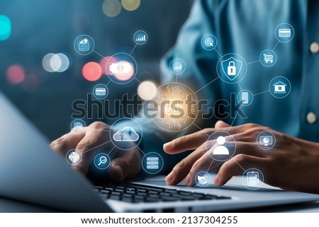AI and IoT concepts of business, businessman working on a laptop computer for artificial intelligence polygon brain with icons of smart city Internet of Things, AI concept and IoT business.