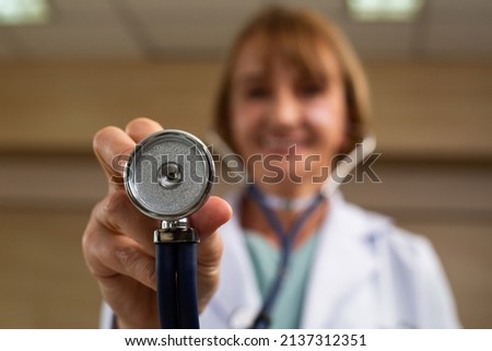Medicare doctor holding stethoscope for support patient person in hospital. Royalty-Free Stock Photo #2137312351