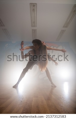Group of multiracial dancers are exercising and practicing in their studio in slow motion
