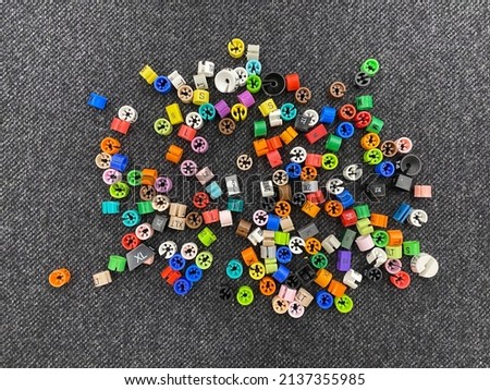 Plastic tags of clothing sizes for the store. Plastic size labels for hangers of clothing store. Plastic size labels for hangers of clothing store with indexes of the XXS, XS, S, M, L, XL, XXL. Royalty-Free Stock Photo #2137355985