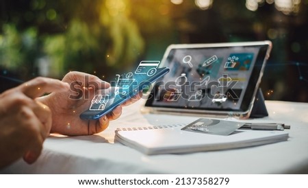 Businessman with mobile smartphone in hand paying online and shopping on virtual interface global network, online banking and digital marketing of e-commerce. Royalty-Free Stock Photo #2137358279