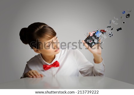 Young woman holding mobile phone with icons