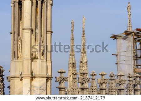 View of carved statues on the walls of the Cathedral (Duomo), in Milan, Lombardy, Northern Italy