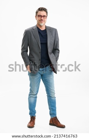 Middle age businessman in business casual. Entrepreneur in jeans and jacket. Mid adult, mature age man, happy smiling. Full length portrait isolated on white. Royalty-Free Stock Photo #2137416763