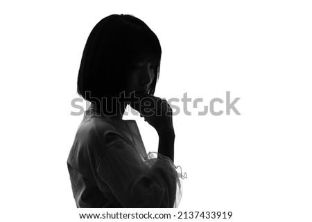 Silhouette of young asian woman. Royalty-Free Stock Photo #2137433919