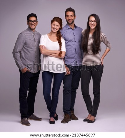 The team you can depend on. Studio shot of a group of diverse young people against a gray background. Royalty-Free Stock Photo #2137445897
