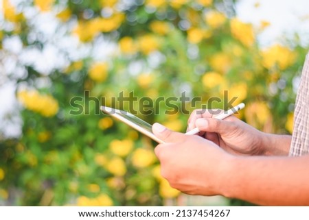 Businessman's hand using a tablet to check information