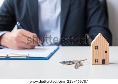 man signing home contract documents. Contract agreement, real estate,  buy and sale and insurance concepts