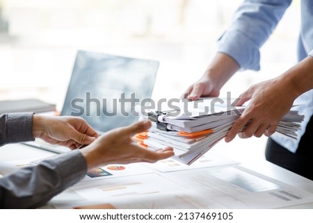 Business Documents, Auditor businesswoman checking searching document legal prepare paperwork or report for analysis TAX time,accountant Documents data contract partner deal in workplace office Royalty-Free Stock Photo #2137469105