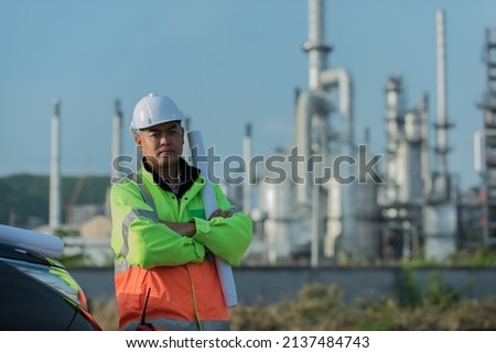 Refinery industry engineer wearing PPE Working at refinery construction site