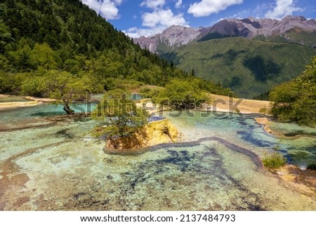 Dreamy landscape size picture, mountain paradise with yellow natural terraces and turquoise ponds, Huanglong Scenic Area, Aba Tibetan Autonomous Prefecture, Sichuan, China 