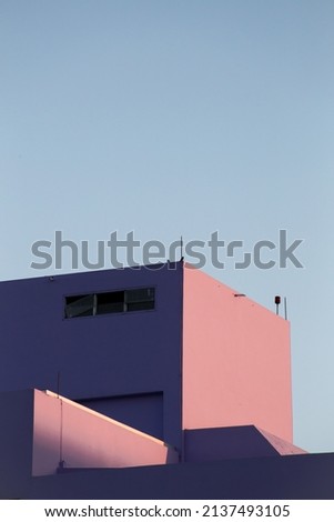 purple building with evening blue sky