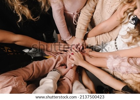 Kids putting their hands together. Many children's hands holding together as a team. Ukrainian people peaceful. Gesture of peaceful relationship of nations. Independence Day of Ukraine. Stop the war. Royalty-Free Stock Photo #2137500423