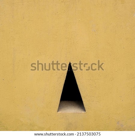 Geometric triangle shape of shadow in concrete wall background backdrop or wallpaper texture. Space for text, title