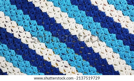A knitted striped texture crocheted. Royalty-Free Stock Photo #2137519729