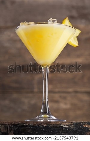 Alcoholic citrus drink in a glass, cocktail. Photography of drinks on a dark background