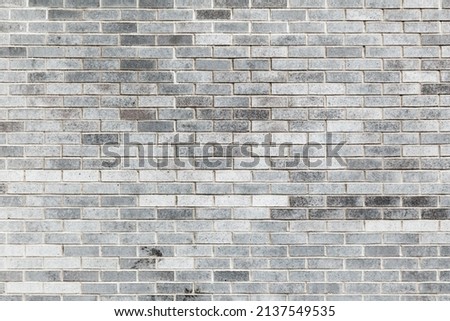 Gray brick wall, frontal background photo texture
