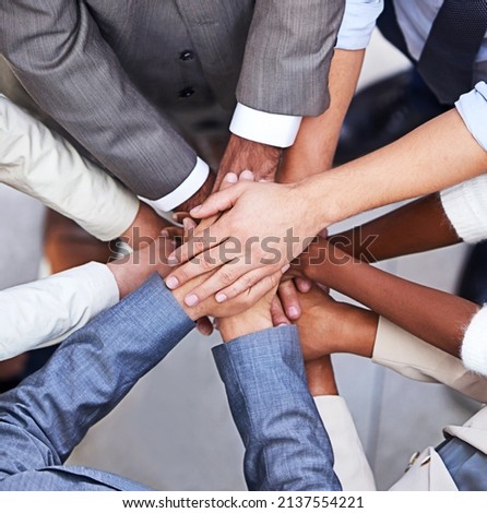 Go, go power business. Cropped shot of a group of businesspeople standing in a huddle with their hands piled up. Royalty-Free Stock Photo #2137554221