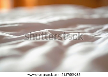 view of the morning crumpled bed in the hotel room. Cozy morning atmosphere .Hotel Ukraine.Shallow depth of field. Selective focus
