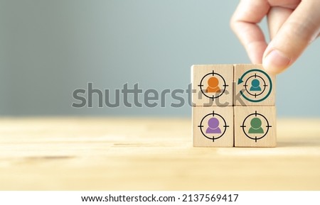 Digital marketing, retargeting or remarketing concept. Online strategies in social media, website visitor management and solution for marketing campaigns. Holding wooden cubes with retargeting icon. Royalty-Free Stock Photo #2137569417