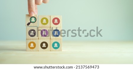 Buyer persona and target customer concept. Customer psychology profile or characteristics. Personalized marketing. Customer analysis for marketing plan. Hand holds wood cubes with buyer persona icons. Royalty-Free Stock Photo #2137569473