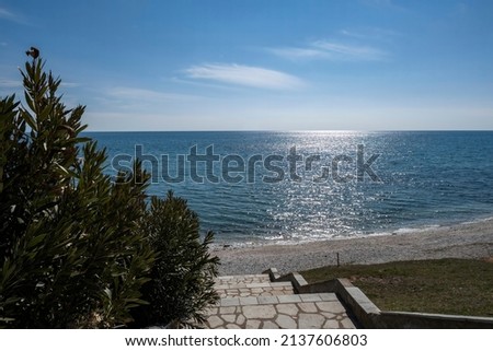 azure sea view and steps down to the beach Royalty-Free Stock Photo #2137606803