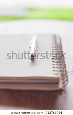 Spiral notebook with pen, stock photo