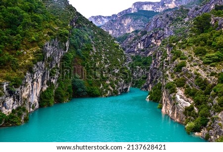 Blue lake in a mountain canyon. Mountain blue lake. Lake in mountains Royalty-Free Stock Photo #2137628421