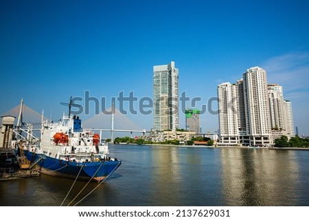 Transport ship the river background condo apartment 
at afternoons