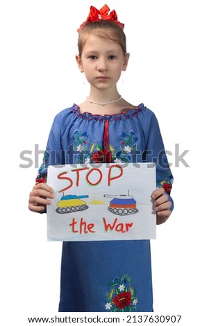 A little sad Ukrainian girl holds a drawing in her hands with the inscription "Stop the war". Studio photo on a white background.