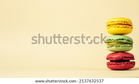 Vintage pastel colored french macaroons, pastel background with space for text