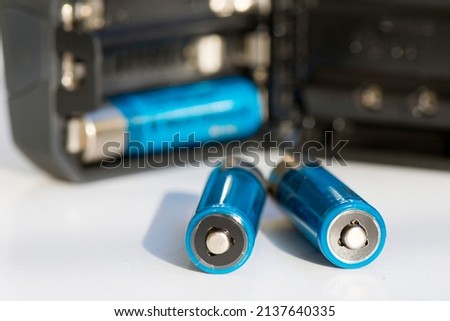 Recharged batteries for tourist headlamp. Specially defocused photo. Royalty-Free Stock Photo #2137640335