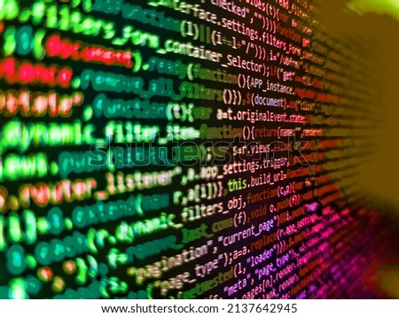 Developing programming binary code. SEO optimization. Developer working on software codes in office. Letters, chars, and digits. Code on dark background. Javascript code in bracket software