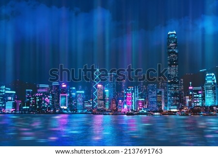 Cityscape of Hong Kong city skyline at night over Victoria Harbor with reflecting in harbour, Cyberpunk color style