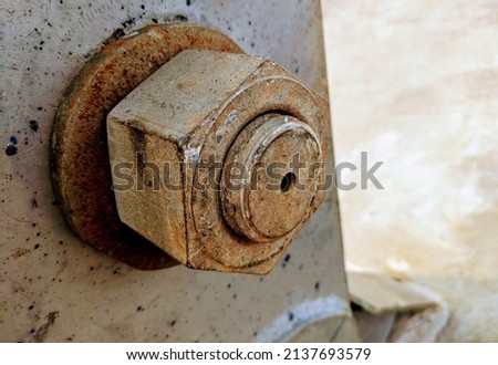 View of the bolts and nuts (fasteners). A bolt is a form of threaded fastener with an external male thread. Bolts are very closely related to screws. Bolts are often used to make a bolted joint. Royalty-Free Stock Photo #2137693579
