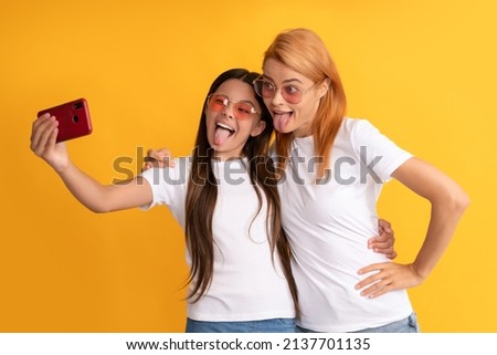 selfie family. modern life. mobile technology. having video call. mother and daughter vlogging