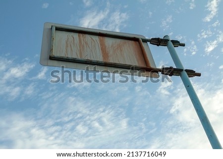 Iron signpost photographed from behind. Billboard