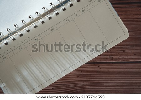 planner on old wooden table vintage style                          