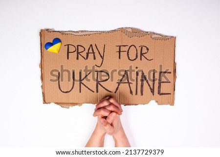 Pray for Ukraine concept background. Concept symbol of help support and no war in the country of Ukraine. 