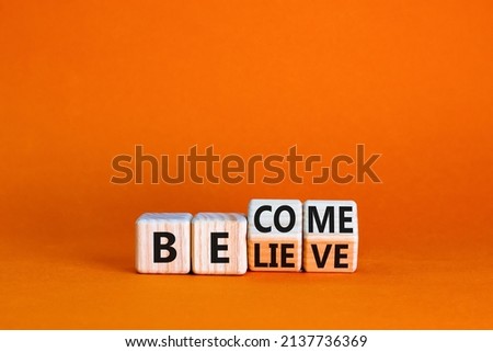 Become or believe symbol. Turned wooden cubes and changed the concept word Believe to Become. Beautiful orange table orange background. Business become or believe concept. Copy space. Royalty-Free Stock Photo #2137736369