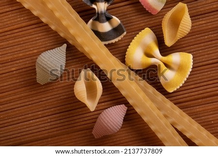 Various raw pasta and spagetti Traditional Italian cuisine. Top view.