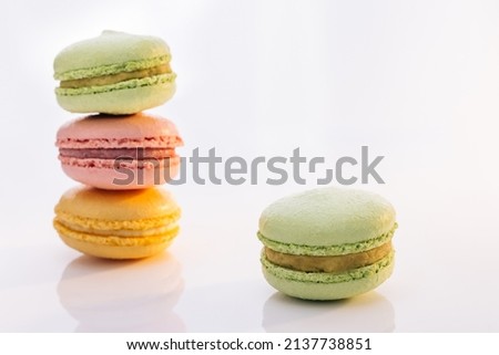 Sweet colorful macarons isolated on white background. Tasty colourful macaroons. Macarons against a bright white background.