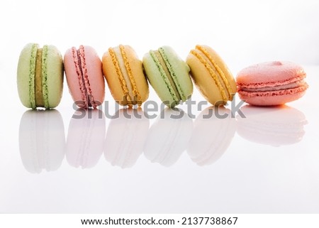 Colorful macarons dessert. French macarons on white background. Different colorful macaroon. Tasty sweet color macaron.